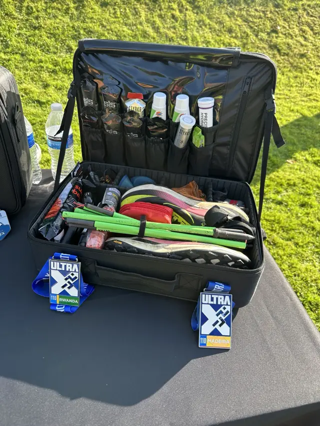 The current MYVICI organiser open at Scurry Events, packed with shoes, folding poles and nutrition
