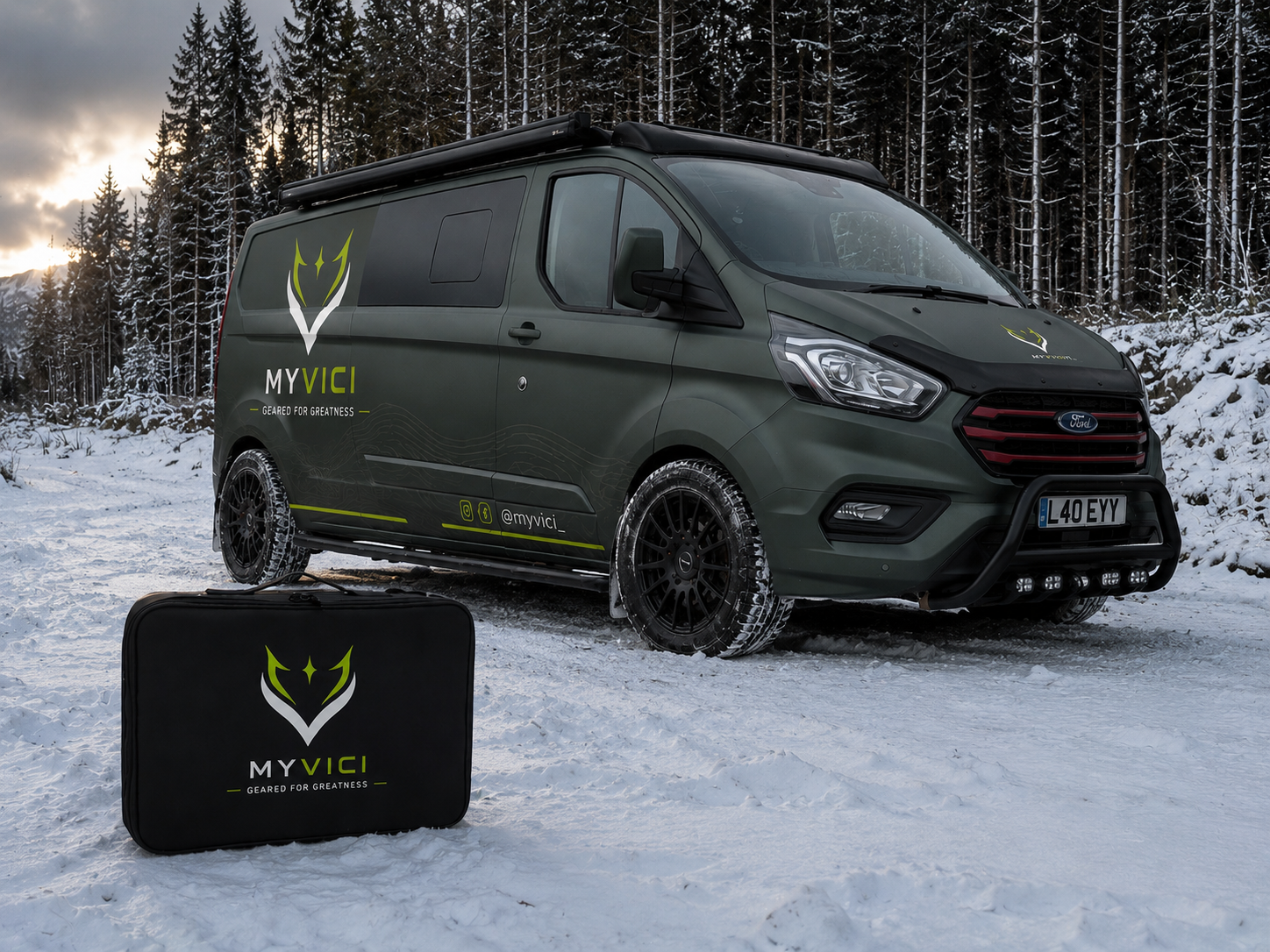 MYVICI branded camper van and bag in snowy outdoor setting